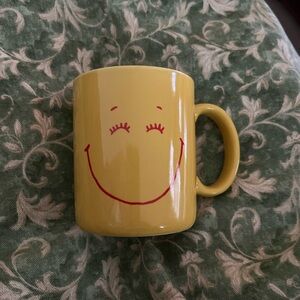 Hallmark vintage "mugs" yellow and red smiley mug.